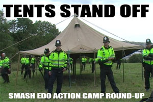 Police dismantle SchNEWS's tatty army marquee at the Smash EDO Action Camp, August 2007
