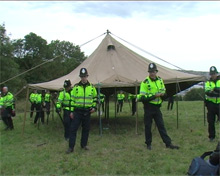 Police arresting the SchNEWS marquee during the Smash EDO summer camp, August 2007